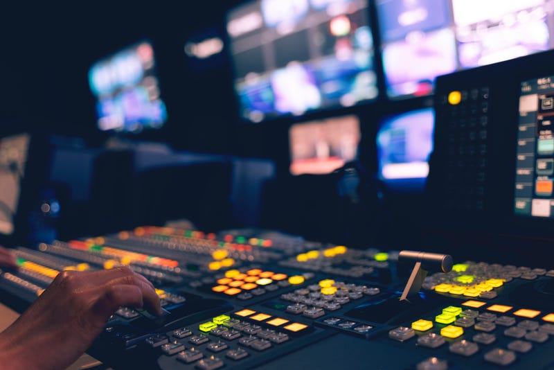 A TV control room, pictured with the lights off.