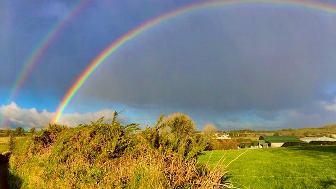 WATCH: Woman captures double rainbow and lightning strike on camera