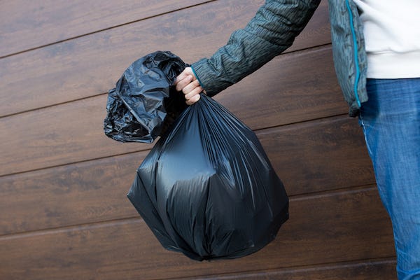 Man holding trash bag