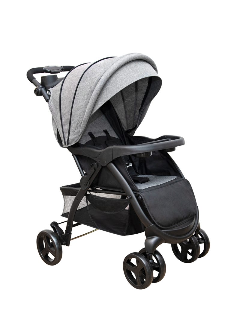 Baby stroller on the white background