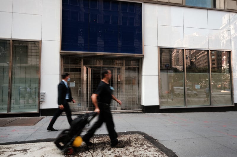 People walk past a closed Gap store in a Manhattan shopping district on August 12, 2020 in New York City.
