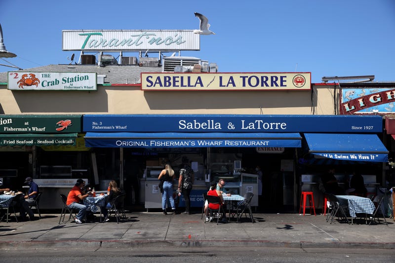 Visitors eat lunch at Fisherman's Wharf on August 13, 2020 in San Francisco, California.