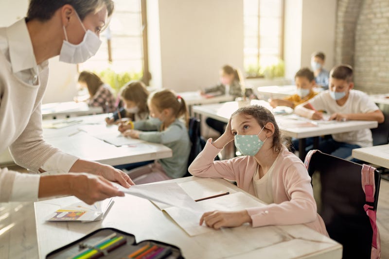 Students and teachers wearing masks in the classroom