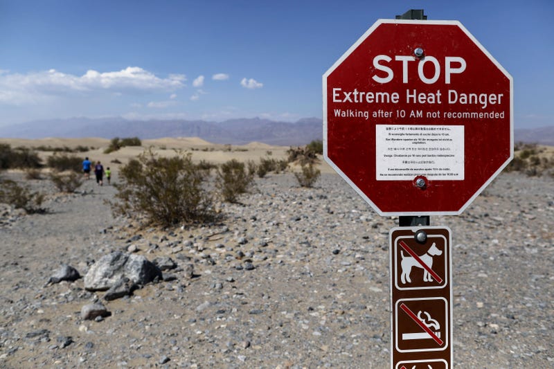 A sign warns of extreme heat at Death Valley