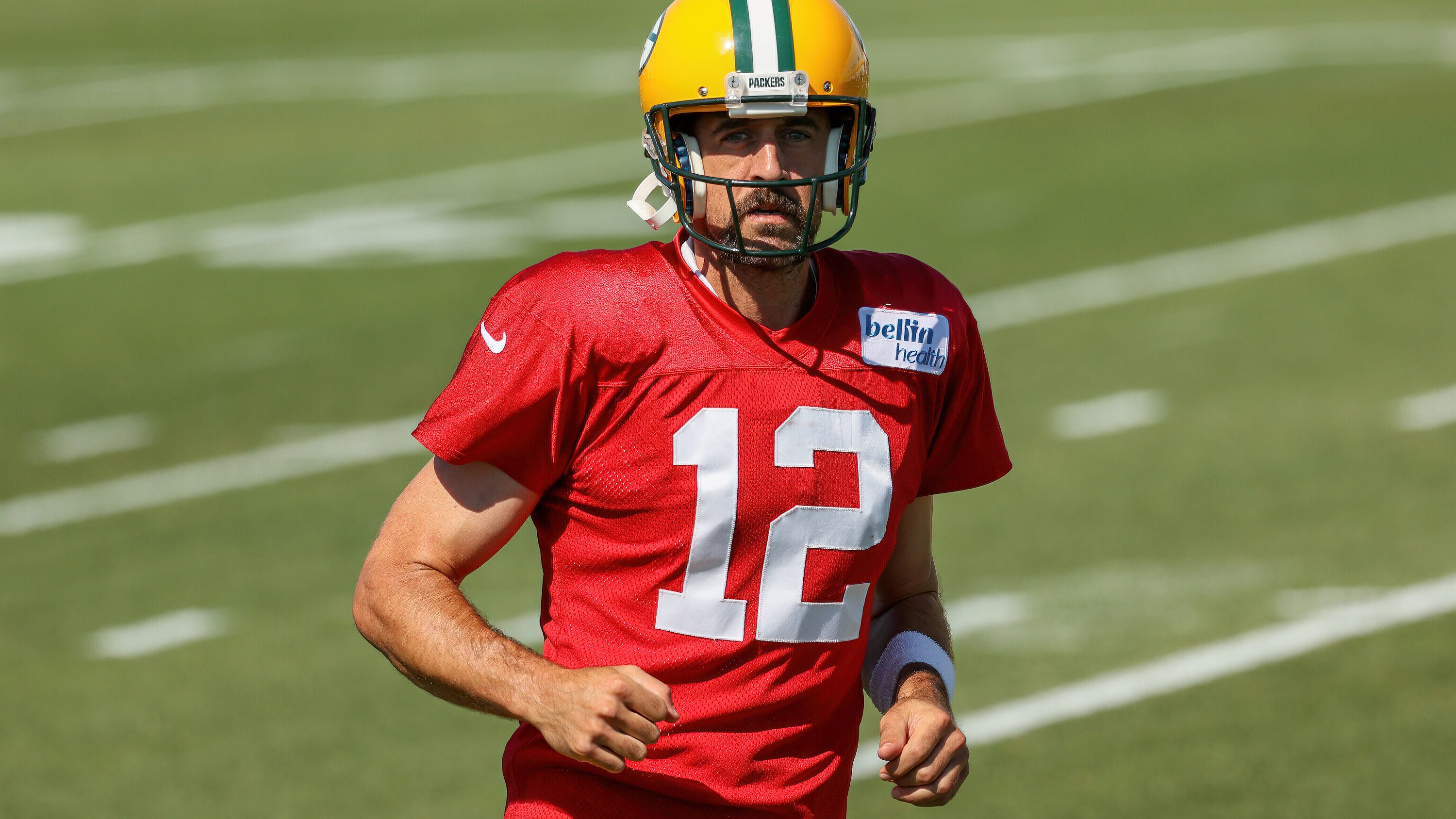 Aaron Rodgers ends holdout from Packers, reports to training camp Tuesday