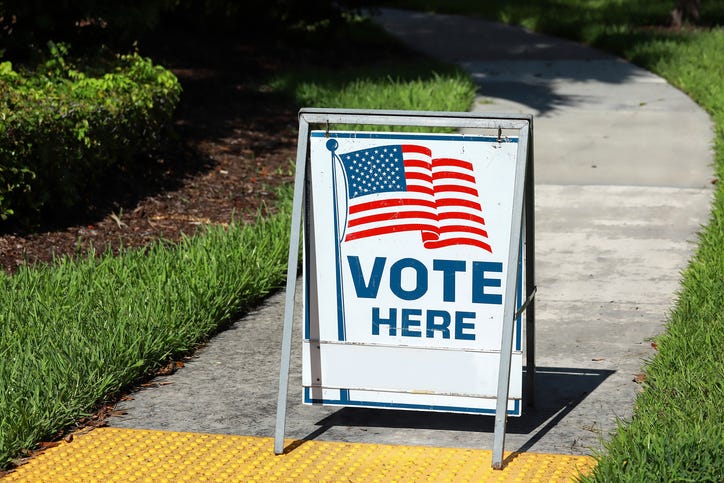 vote her sign