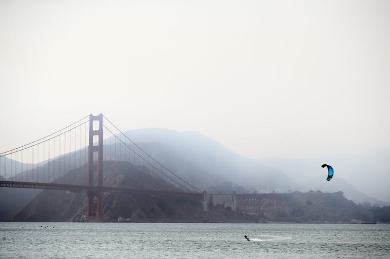 A kiteboarders enjoys the strong winds near the Golden Gate Bridge even with heavy smoke from the nearby wild fires on August 20, 2020 in San Francisco, California.