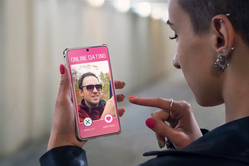 A young attractive girl is looking for a couple in an online Dating app.