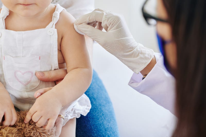 A baby receiving a vaccine.