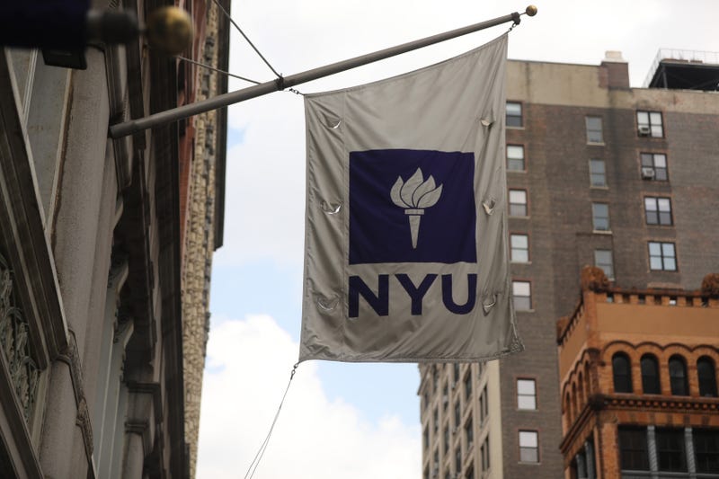 A New York University flag flies outside the NYU business school in Manhattan