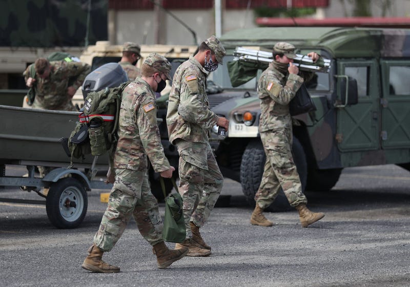 Members of the Louisiana National Guard prepare for the arrival of a hurricane.