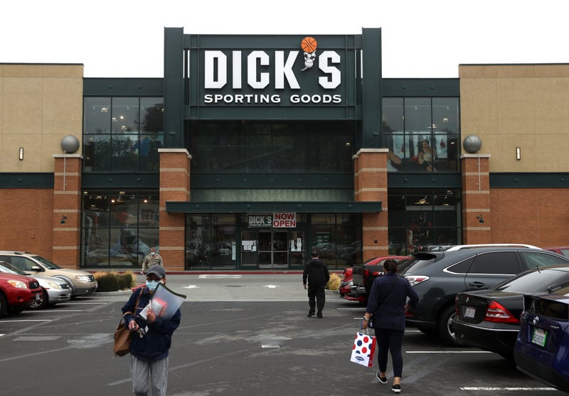 DALY CITY, CALIFORNIA - AUGUST 26: Customers walk in front of a Dick's Sporting Goods store on August 26, 2020 in Daly City, California. Dick's Sporting Goods reported better-than-expected second quarter earnings that were driven by online sales. The sporting goods retailer's net income spiked nearly 148% to $276.8 million compared with $112.5 million one year ago. 