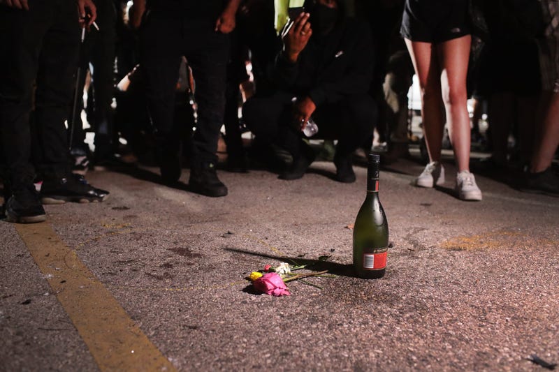 A small memorial sits on the site where a young activist was shot and killed yesterday while protesting the August 23rd shooting of Jacob Blake on August 26, 2020 in Kenosha, Wisconsin. 