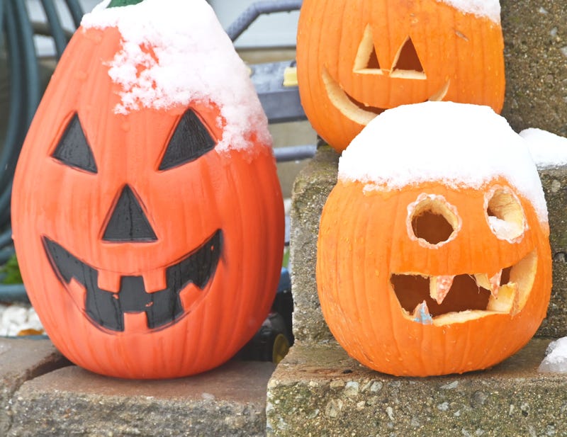 Snowfall in October on Halloween display