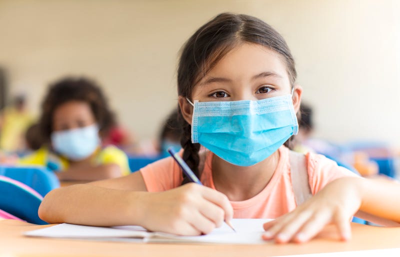 students wearing mask in the classroom.