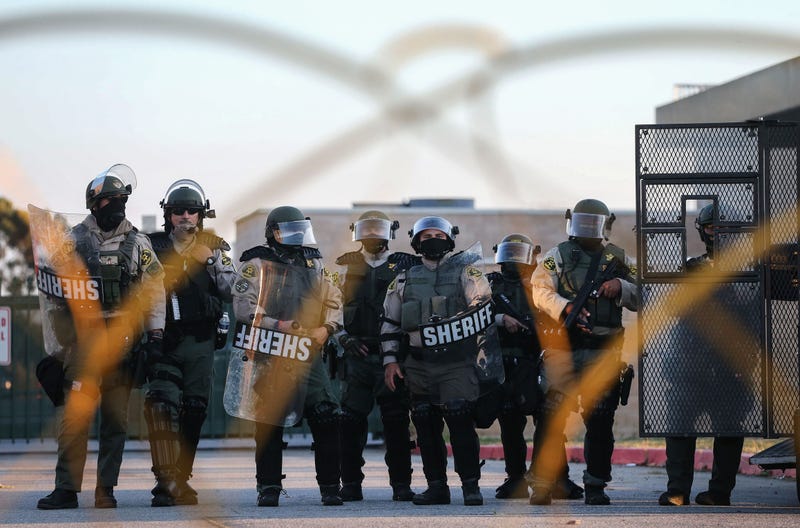 line of sheriff deputies in riot gear