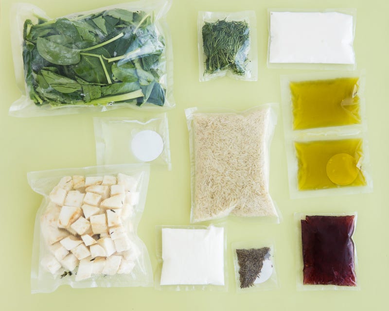 set of products for a vegetarian dinner: rice, spinach, celery, dill, Olive oil, sauces and spices. Set for delivery of food for dinner on a light background. Cooking at home, home cooking