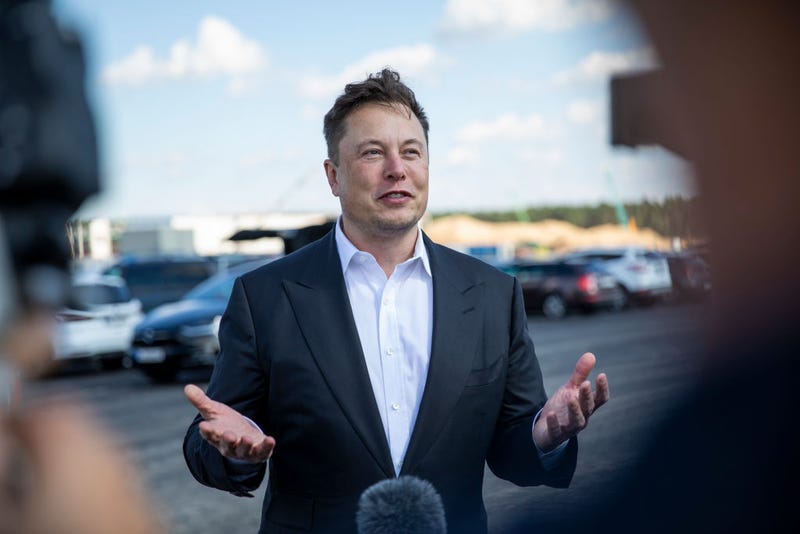 Tesla head Elon Musk talks to the press as he arrives to to have a look at the construction site of the new Tesla Gigafactory near Berlin on September 03, 2020 near Gruenheide, Germany.