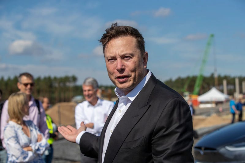 Tesla head Elon Musk talks to the press as he arrives to to have a look at the construction site of the new Tesla Gigafactory near Berlin on September 03, 2020 near Gruenheide, Germany.