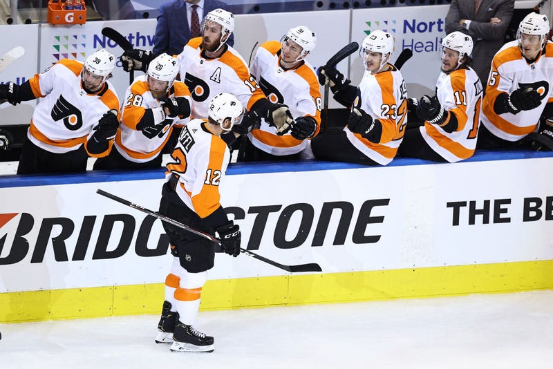 Michael Raffl #12 of the Philadelphia Flyers is congratulated by his teammates after scoring a goal