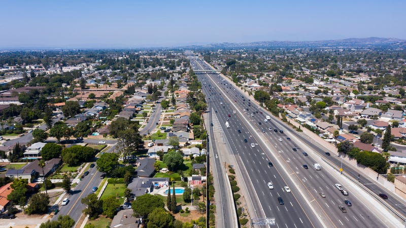 Day time aerial view of the 55 Freeway through the cities of Santa Ana and Tustin, California.
