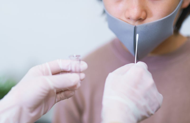 Person getting tested in a mask. 