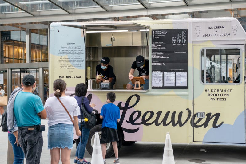 People wait in line for ice cream at a Van Leeuwen truck in Hudson Yards as the city continues Phase 4 of re-opening following restrictions imposed to slow the spread of coronavirus on September 13, 2020 in New York City.