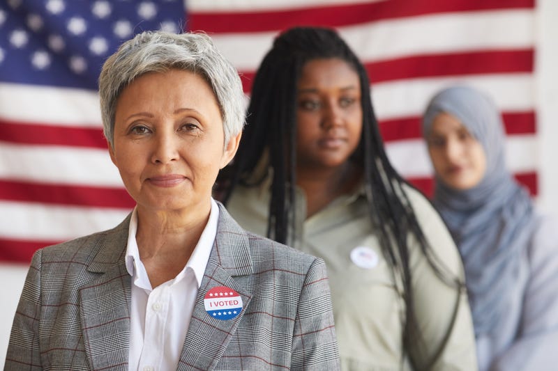 Multi-ethnic group of people at polling station on election day