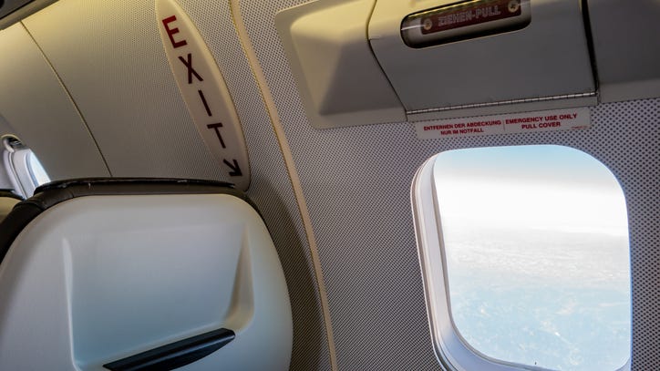 Airline passenger opens emergency exit and jumps onto tarmac after flight is delayed