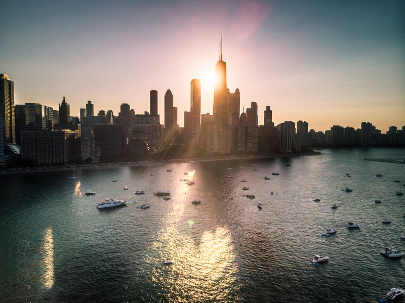 Lake Michigan and Chicago skyline shown at sunset