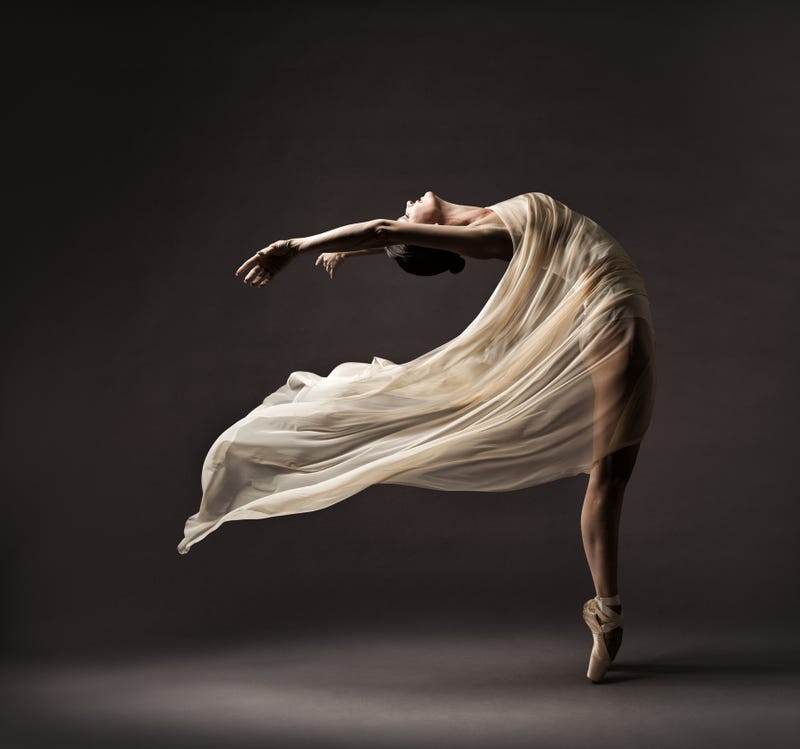 Ballerina Dancing with Silk Fabric