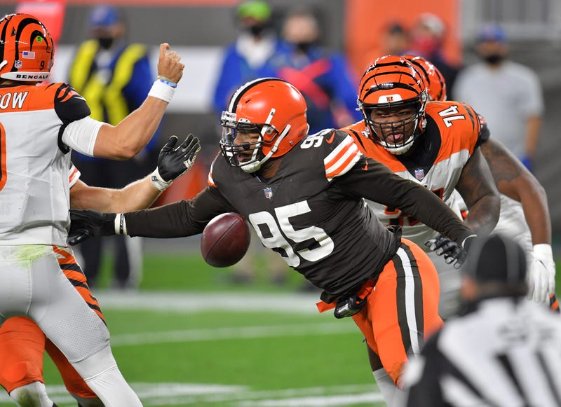 Myles Garrett of the Cleveland Browns knocks the ball out of the hands of Joe Burrow of the Cincinnati Bengals during the second half at FirstEnergy Stadium on September 17, 2020