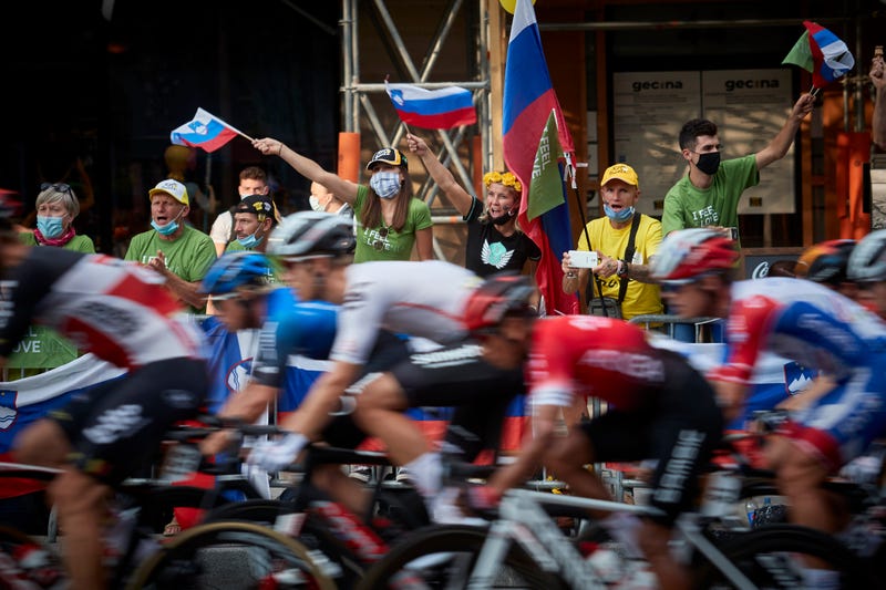 Slovenian cycling fans watch the final stage of the Tour de France on the Champs Elysees and cheer on their compatriot Tadej Pogacar as he wins this year's Tour on September 20, 2020 in Paris, France.