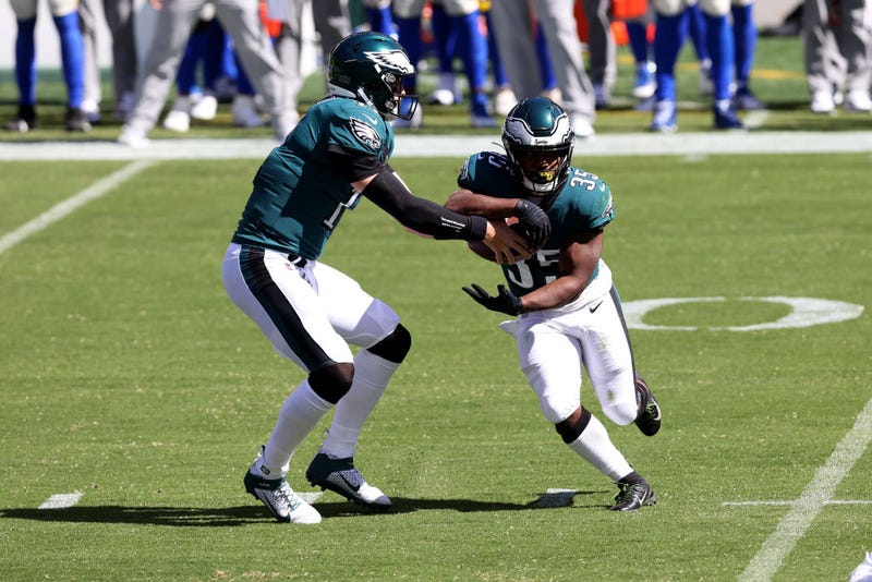 Boston Scott takes a handoff from Carson Wentz.