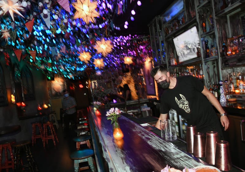 Barback Jaime Torres prepares to open the bartop for the first time at Lucky Day bar in the Fremont East Entertainment District on September 20, 2020 in Las Vegas, Nevada.
