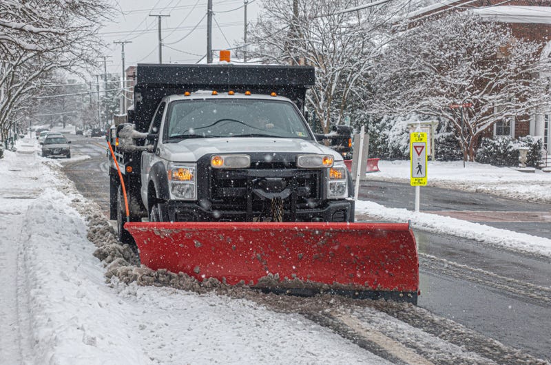 Snow plow clearing a road