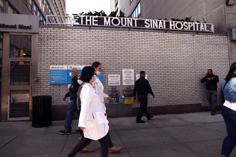 File photo: People walk outside of Mount Sinai Hospital in Manhattan last fall