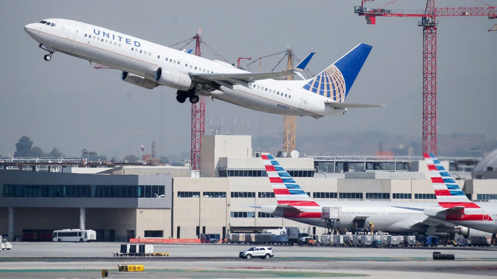 Woman detained after running onto LAX tarmac