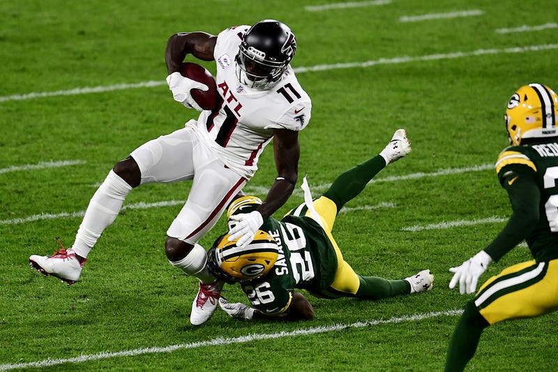 Darnell Savage #26 of the Green Bay Packers attempts to tackle Julio Jones #11 of the Atlanta Falcons during the first half at Lambeau Field on October 05, 2020 in Green Bay, Wisconsin.