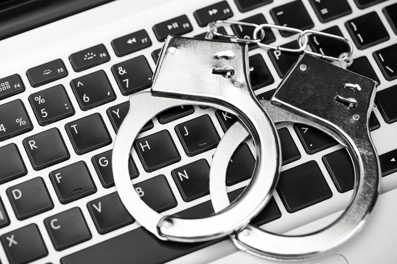 Laptop and handcuffs