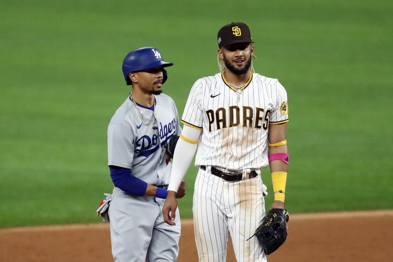 Padres shortstop Fernando Tatis Jr. stands next to Dodgers outfielder Mookie Betts.