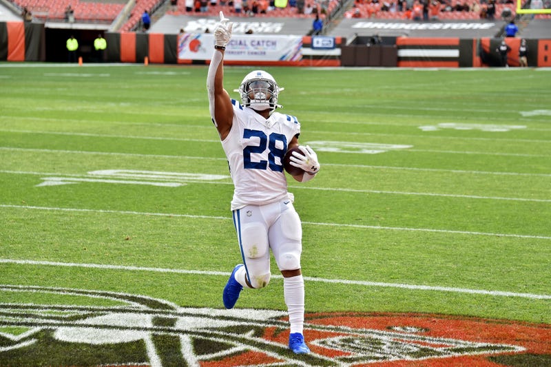 Colts running back Jonathan Taylor celebrates his touchdown run against Cleveland