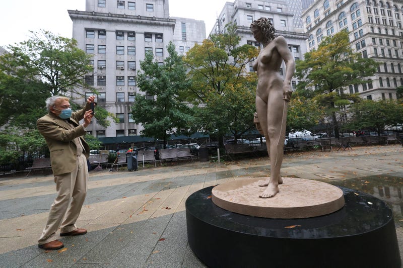 Richard Lewkowicz takes a photo of the newly installed statue of "Medusa With The Head of Perseus" by Argentine-Italian artist Luciano Garbati stands in Collect Pond Park on October 13, 2020 in New York City. 