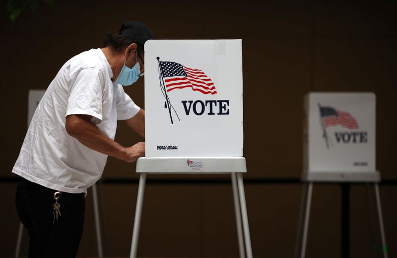 A voter fills out his ballot while early voting on October 13, 2020 in San Jose, California.