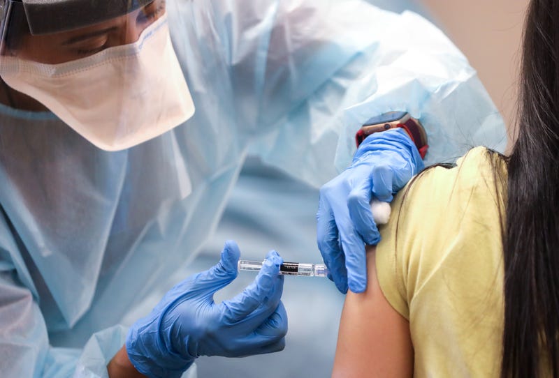 A nurse administers a flu shot at a free clinic held at a local library in Lakewood, California.
