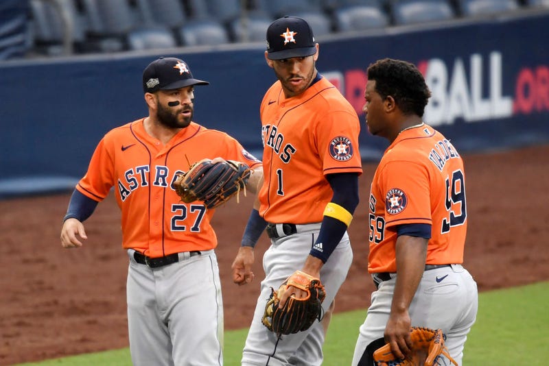 Framber Valdez #59 of the Houston Astros celebrates a double play with teammate Jose Altuve #27 and Carlos Correa #1 against the Tampa Bay Rays during the sixth inning in Game Six of the American League Championship Series at PETCO Park on October 16, 2020 in San Diego, California.
