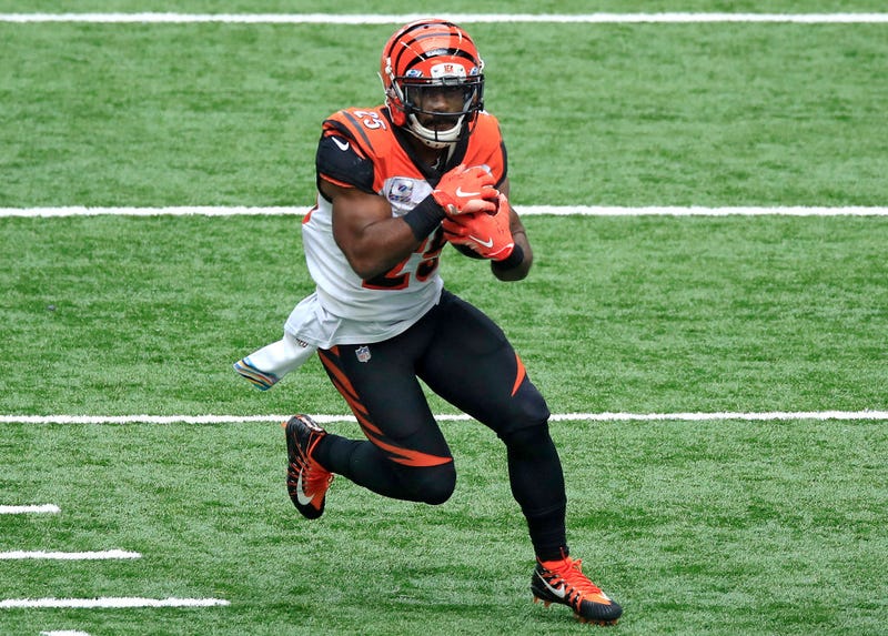 Giovani Bernard tucks the ball as he runs.