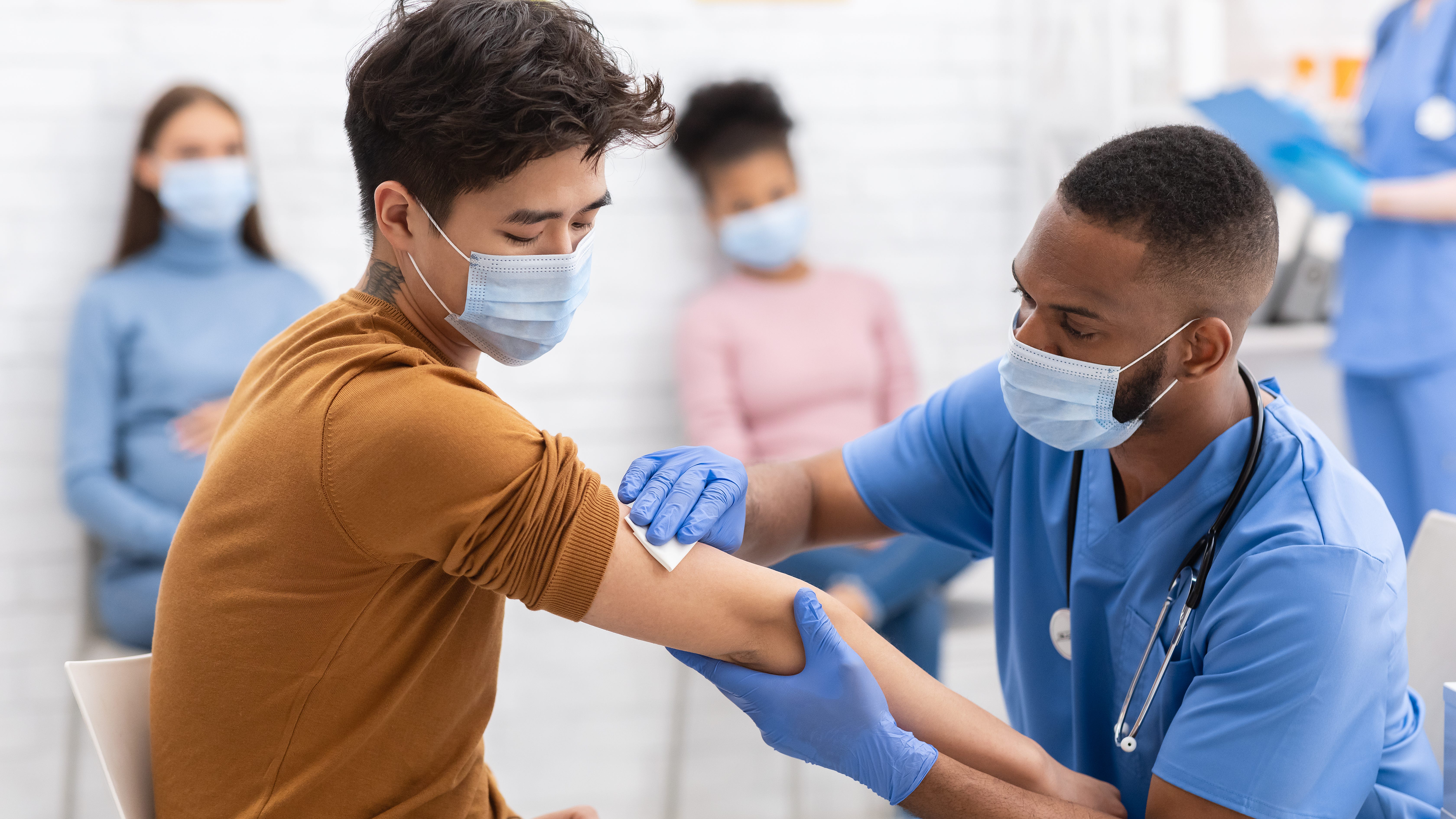 Fatigue, nausea & swelling: Understanding possible COVID-19 vaccine reactions