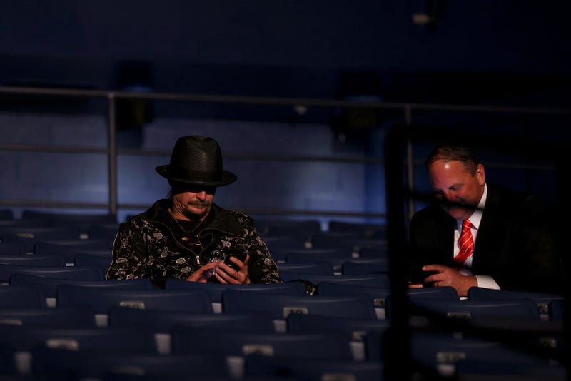 Kid Rock (L) takes his seat without wearing a mask, prior to being asked to wear one, at the final presidential debate between U.S. President Donald Trump and Democratic presidential nominee Joe Biden at Belmont University on October 22, 2020 in Nashville, Tennessee. This is the last debate between the two candidates before the election on November 3. 