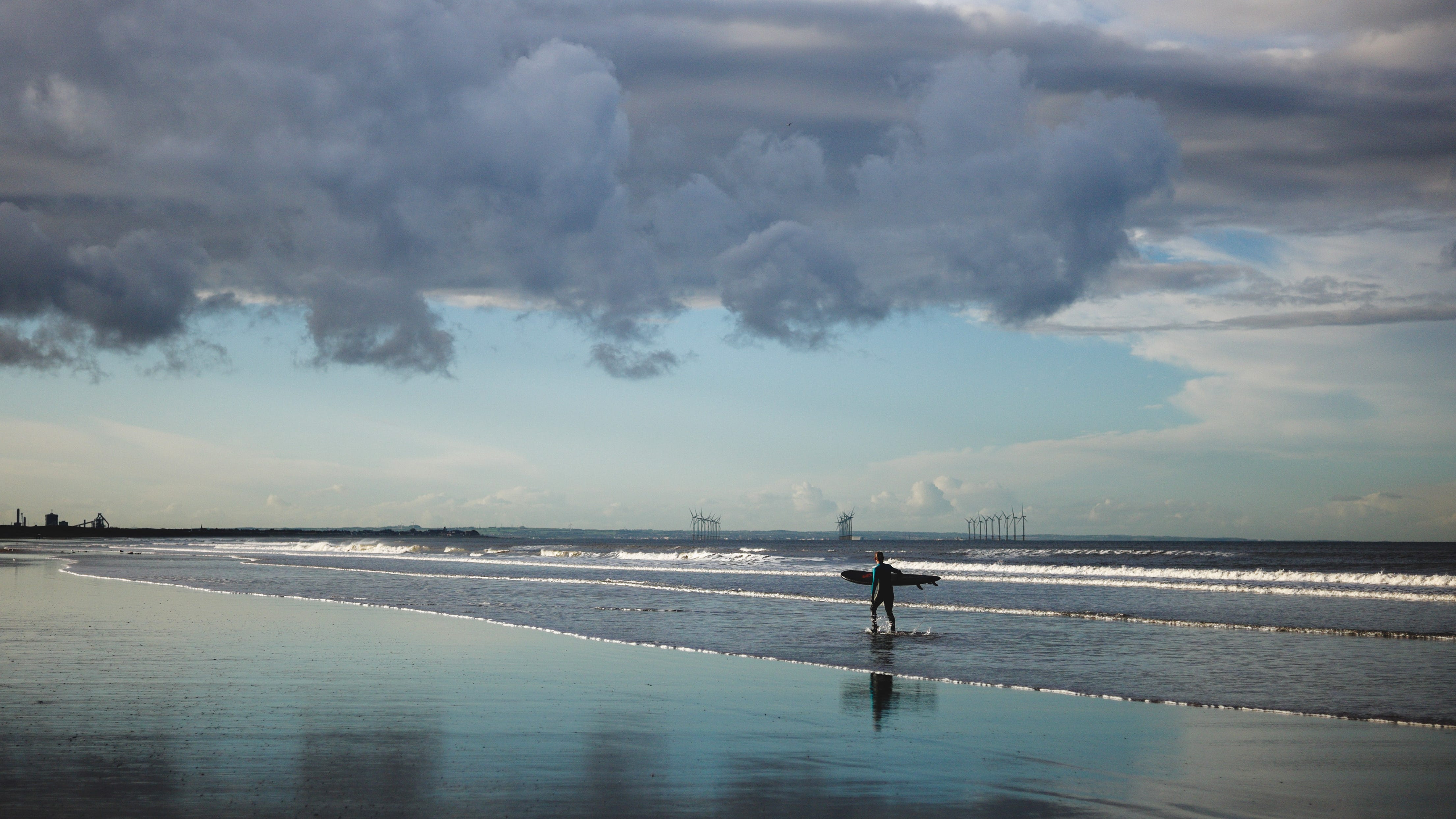 Surfer falls unconscious in water, saved by two others